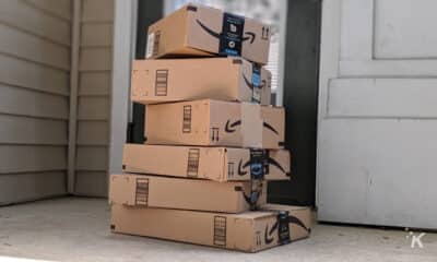 amazon delivery boxes stacked on a porch