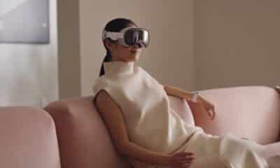 A person wearing a Apple Vision Pro in a living room setting.