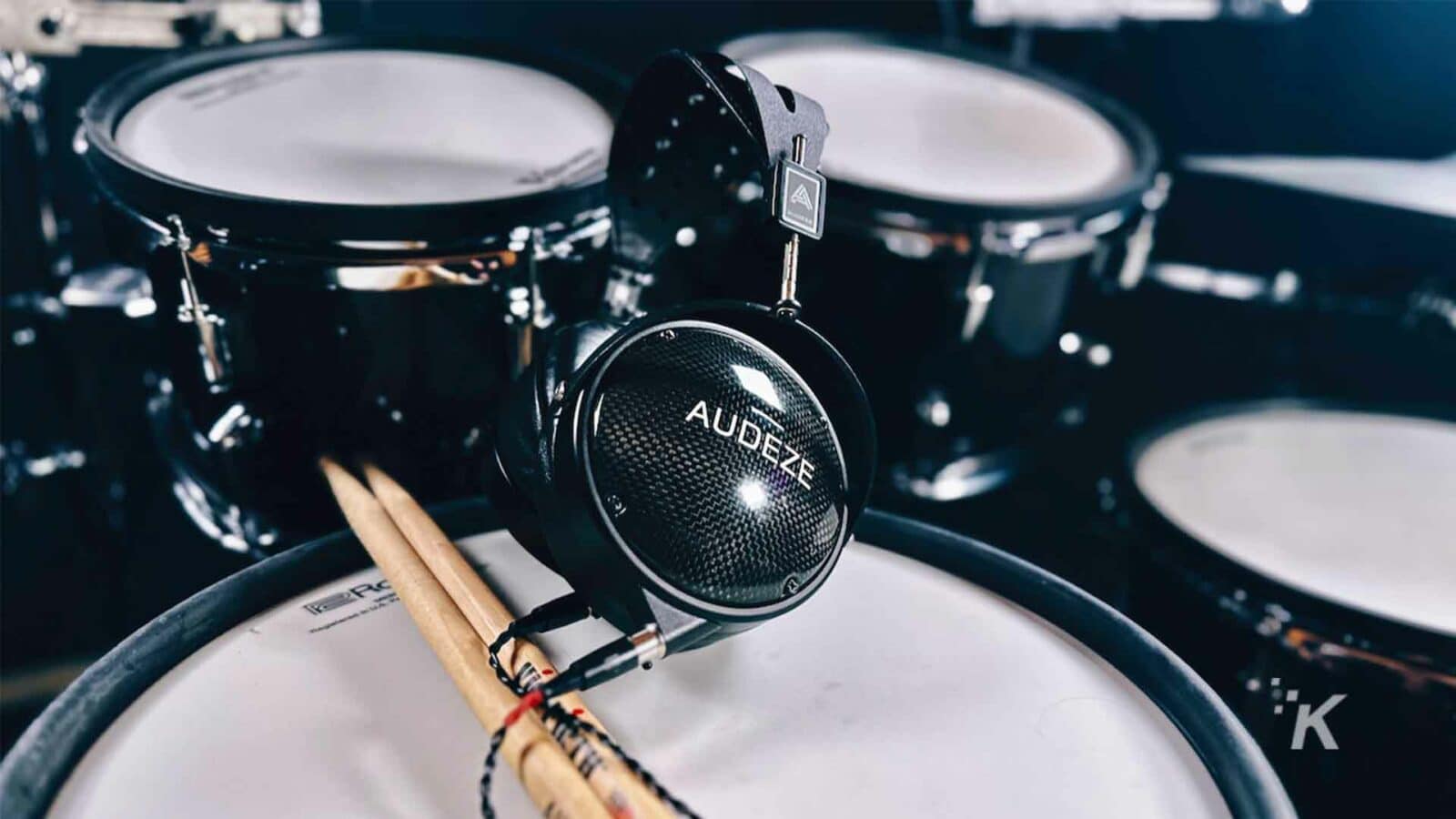 The drum set with a set of Audeze headphones.