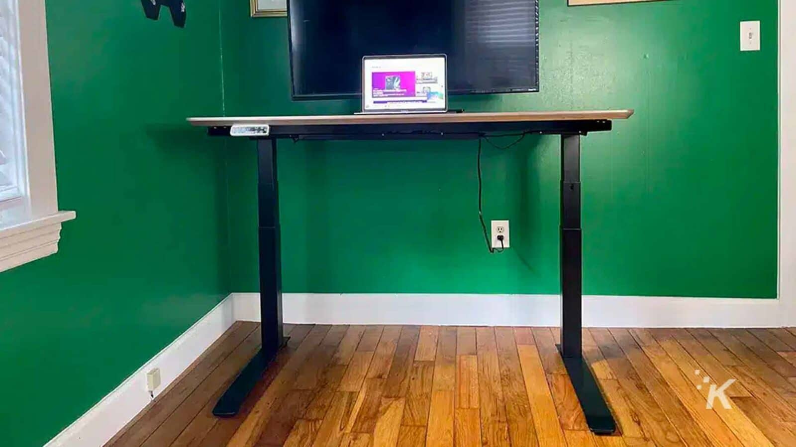 The desk holds a computer.