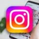 instagram logo with blurred phone background