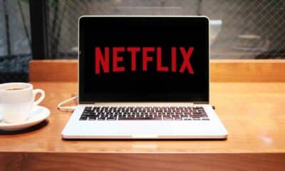 netflix on a macbook sitting on a table