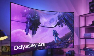 samsung odyssey ark in office gaming setup with lights in the background