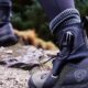 hiking boots on person climbing mountain