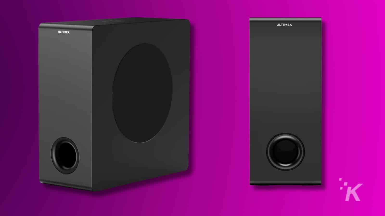 A studio monitor, subwoofer, and sound box are producing stereophonic sound from an array of electronic devices and audio equipment.