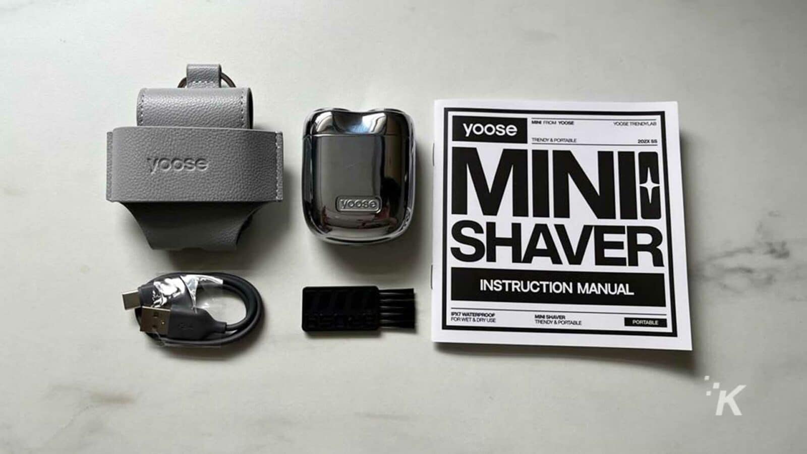 This image is an instruction manual for a waterproof, wet and dry mini shaver called the 202X 85 Mini Vooso Shaver. Full Text: yoose LEON FROM YOOUR YOUGE THENDRAB TRENDY & PORTABLE 202X 85 MINI voose VOOSO SHAVER INSTRUCTION MANUAL PX7 WATERPROOF FORWET & DRYUEZ MIN SHAVER TRENDY & PORTABLE PORTABLE 'K