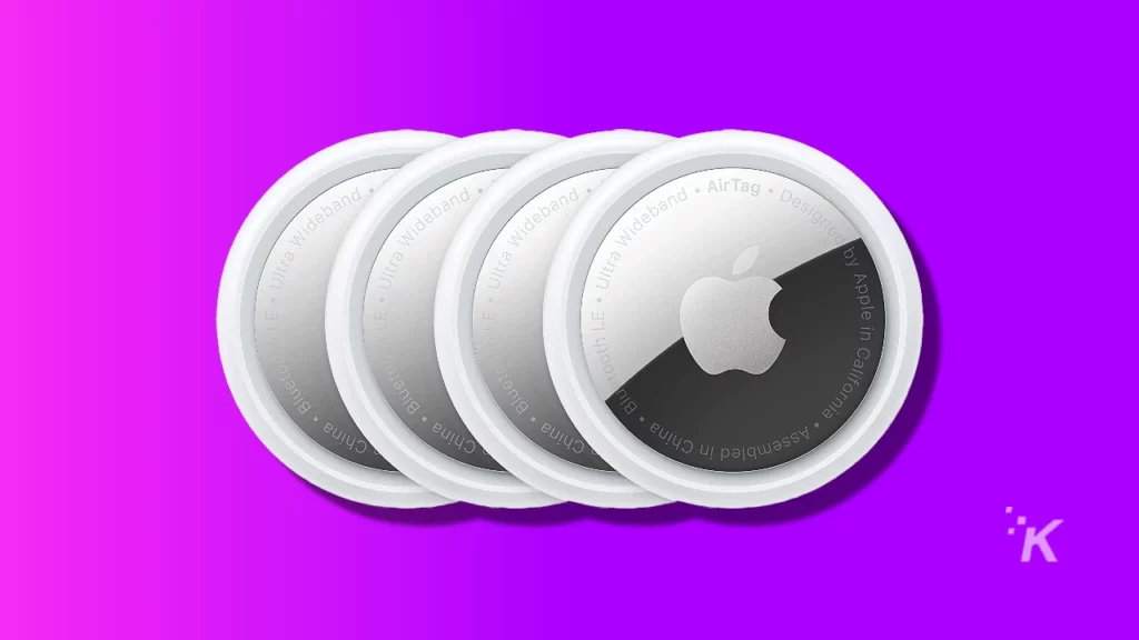 image of apple airtags on purple background
