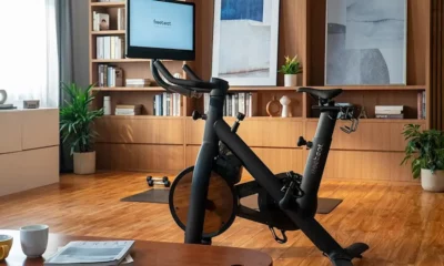 freebeat lit exercise bike in home office over hardwood floor