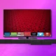 image of a tv and soundbar on a purple background