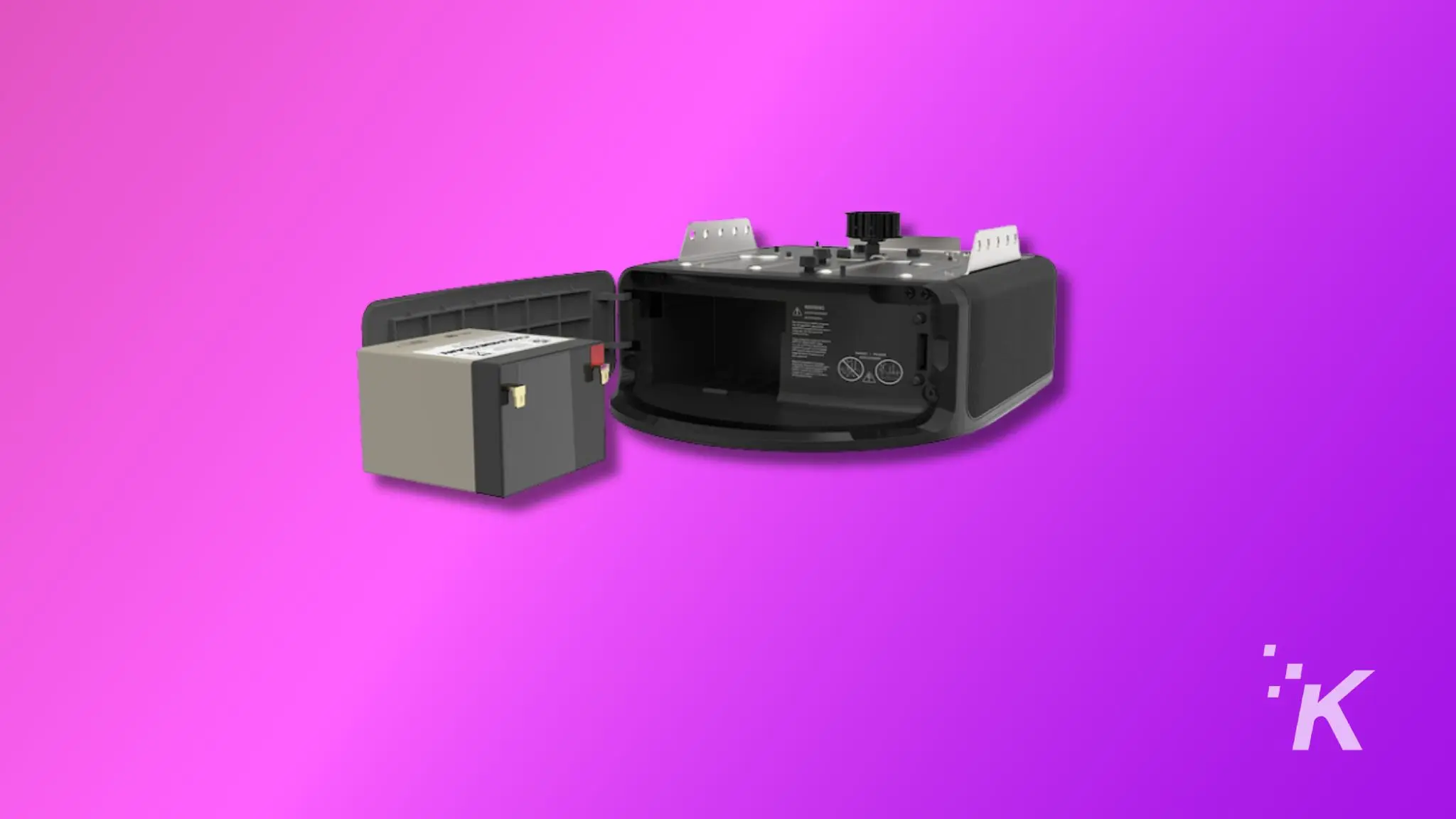 The image showing is garage door opener and its battery on the purple background