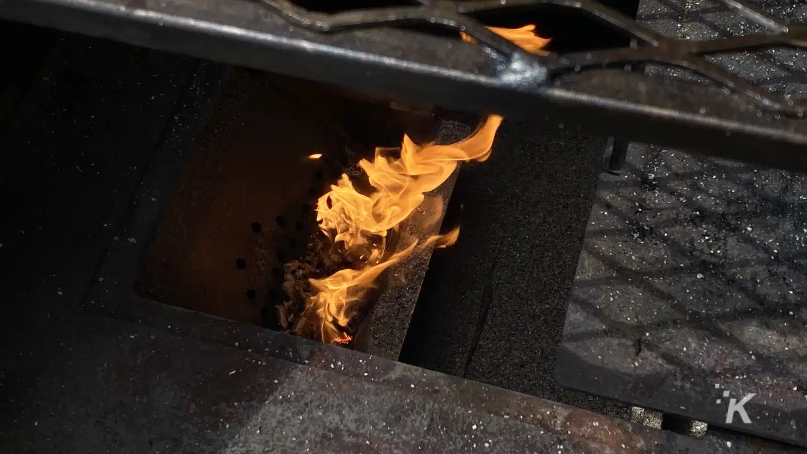pellet grill with roaring flames 